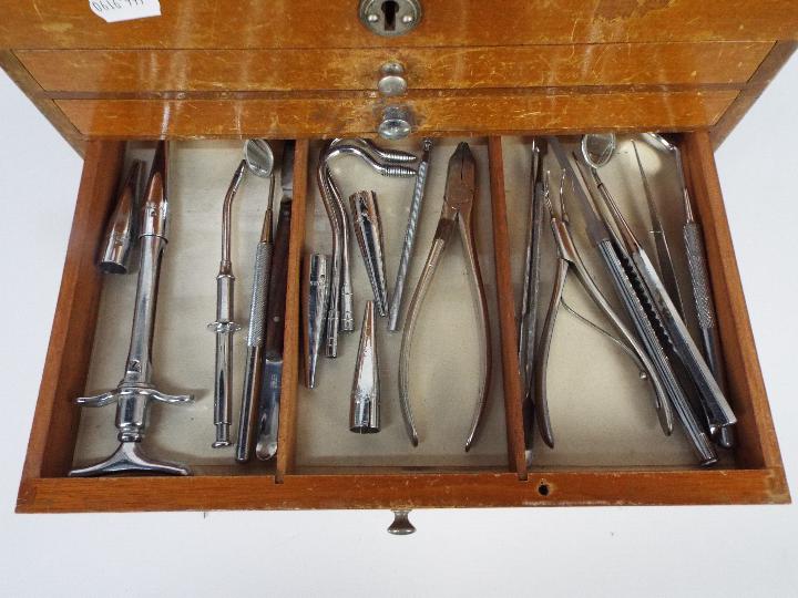 A dentists counter top or portable cabinet containing a quantity of dental tools and similar. - Image 6 of 9