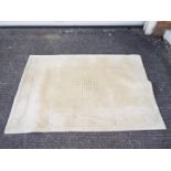 A Chinese wool carpet measuring approximately 182 cm x 120 cm