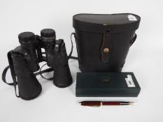 A Cross fountain pen with 14ct nib, contained in original box and a cased set of binoculars.