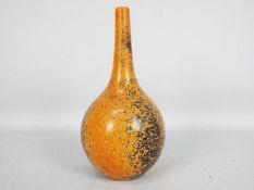 John Nuttgens - A 20th century bottle vases in a vibrant orange colour with black speckling,