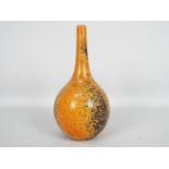 John Nuttgens - A 20th century bottle vases in a vibrant orange colour with black speckling,