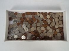 A collection of coins, predominantly UK with a small quantity of foreign.
