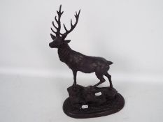 A bronzed metal model of a stag stood atop a rocky outcrop, after Pierre Jules Mene, signed,
