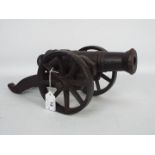 A cast iron model of a cannon,