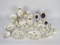 Wedgwood - A collection of Wild Strawberry pattern ceramics, in excess of thirty pieces.