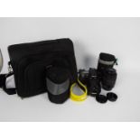 Photography - A Nikon D80 camera with additional lens and carry case.