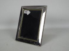 A silver fronted, easel back photograph frame, Sheffield assay, approximately 22 cm x 17 cm.