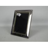 A silver fronted, easel back photograph frame, Sheffield assay, approximately 22 cm x 17 cm.