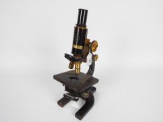 A Spencer Lens Company, Buffalo, New York black lacquer and brass microscope, serial number 59967.
