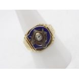 A gentleman's yellow metal, enamel and diamond Masonic ring, the shank interior stamped 9ct,
