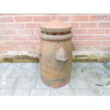 An unusual terracotta clay vented chimney pot with 'Ventop' cowl flue ventilator,