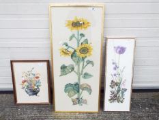 Three framed needlework depictions of flowers, largest approximately 94 cm x 41 cm.
