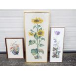 Three framed needlework depictions of flowers, largest approximately 94 cm x 41 cm.