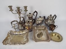 A collection of plated ware to include teapots, candelabra, cream jug and similar.