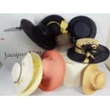 Two hat boxes containing a quantity of lady's hats, Jacques Vert and similar.