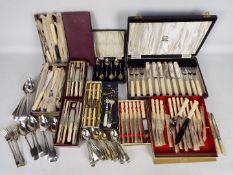 A collection of vintage flatware, plated and stainless, part boxed.