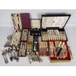 A collection of vintage flatware, plated and stainless, part boxed.