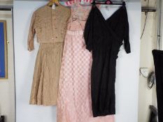 Three vintage dresses comprising a Jean Varon pink A line dress with lace and chequered pattern,