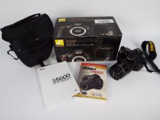 Photography - A Nikon D5000 camera in carry case with original box.