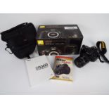 Photography - A Nikon D5000 camera in carry case with original box.