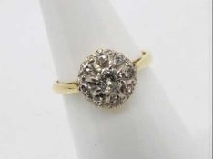 An 18ct yellow gold diamond cluster ring, size K,