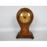 An Edwardian inlaid balloon cased mantel clock, Roman numerals to the dial, approximately 23 cm (h),