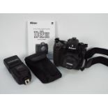 Photography - A Nikon D2H camera with flash