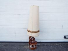A vintage Skandesco ceramic lamp base with tall shade,