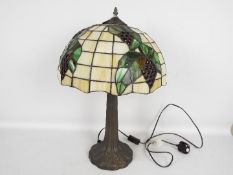 A large Tiffany style table lamp,
