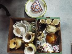 A mixed lot of ceramics to include vases, jugs, plates and similar.