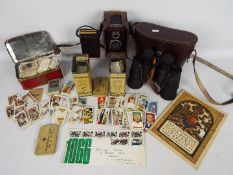 Lot to include three vintage tins of cigarette cards, cased pair of Dolland binoculars,