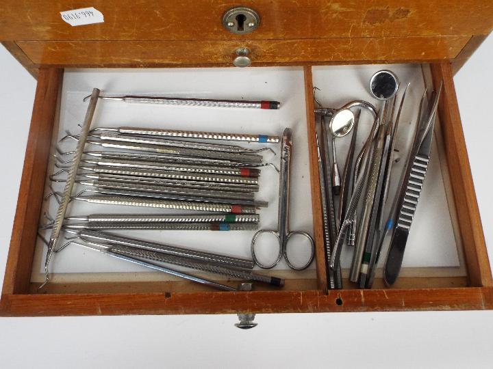 A dentists counter top or portable cabinet containing a quantity of dental tools and similar. - Image 7 of 9