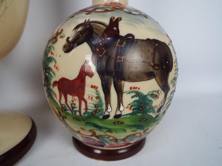 A garniture of three hand painted glass vases comprising ovoid pedestal vase with cover, - Image 2 of 4