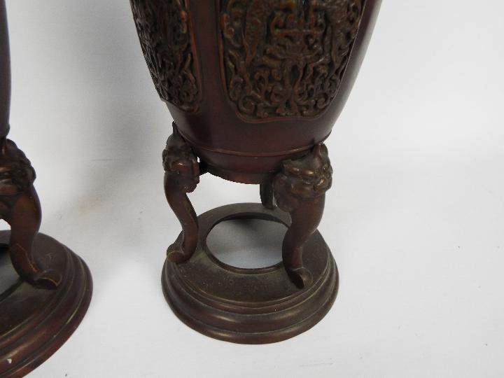 A pair of cast metal vases with twin chilong handles, cast decorative panels, - Image 3 of 5