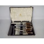 A Mappin & Webb seven piece carving set with white metal mounts and contained in fitted case.