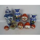 A group of Chinese ceramics to include ginger jars and covers, vases and similar,