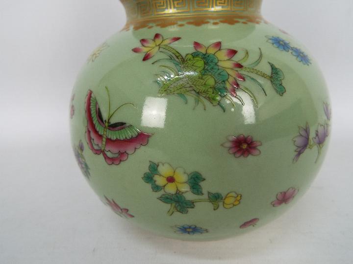 A Chinese double gourd vase decorated with flowers and butterflies against a green ground, - Image 3 of 18