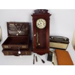 Two vintage brief cases, a Roberts radio, a Rapport mahogany cased wall clock and similar.