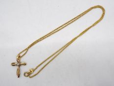 A 9ct gold, stone set, cross pendant on 9ct gold chain (clasp A/F), 44 cm (l), approximately 3.