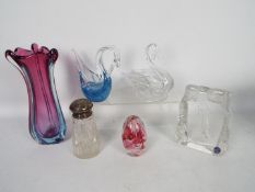 A collection of glassware to include vase, paperweight, silver topped sugar shaker and similar.