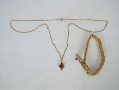 A 9ct yellow gold necklace with yellow metal, opal set pendant, chain approximately 56 cm, 5.
