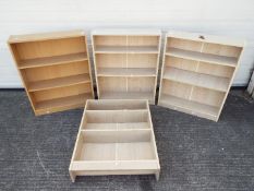 Four freestanding bookcases, approximately 83 cm x 65 cm x 16 cm.