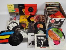 A collection of 7" vinyl records to include Queen, The Beatles, The Police, Pet Shop Boys,
