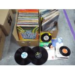 A quantity of 12" vinyl records to include The Bee Gees, ABBA, The Beatles, Motown, George Benson,