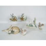 Lladro - A collection of animal figurines and groups to include fox and cub, two bird figurines,