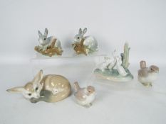 Lladro - A collection of animal figurines and groups to include fox and cub, two bird figurines,