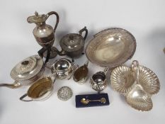 A collection of plated ware to include teapots, claret jug, cream jugs, sugar bowls and similar.