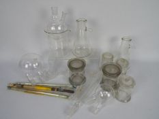 Vintage scientific and medical glassware to include thermometers, jars and similar.