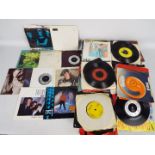 A quantity of 7" vinyl records to include The Police, Pet Shop Boys, Madness, Fleetwood Mac,