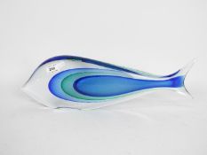 A large Murano style ornament in the form of a stylised fish, signed to the base,